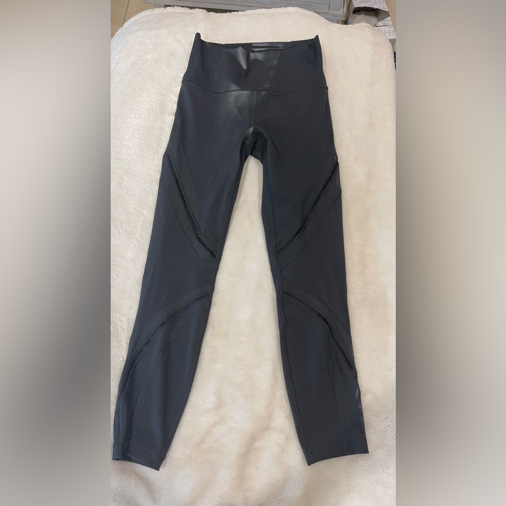 Lululemon black leggings - Size 6 Excellent Condition.Fun Mesh design On Front
